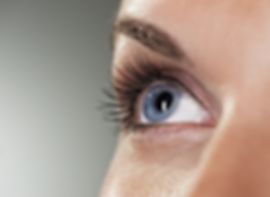 Blue eye on grey background